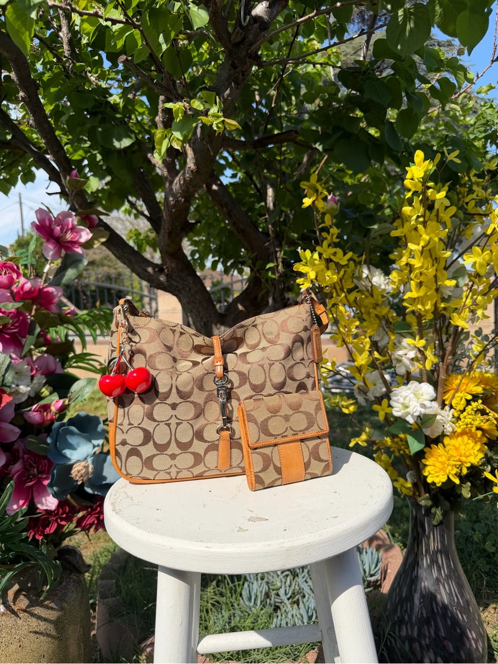 Coach Tan Monogram Shoulder Bag with Orange Trim and Red Cherry Charm
